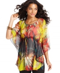 A flattering babydoll silhouette and bold print combine to create a retro-cool look from Cha Cha Vente!