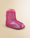 Glitter adorns this update on the original Ugg design, in sheepskin to keep little feet warm and snug.Pull-on styleSheepskin upperSheepskin liningElastic backLeather solePadded insoleImported