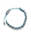 Edgy, with a feminine undertone. Ali Khan's silver-plated mixed metal bracelet features several tiny skulls along a turquoise-colored cord. Bracelet is fully adjustable. Approximate length: 12 inches. Approximate diameter: 2 inches.