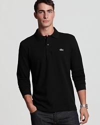 Lacoste's classic-fit polo with long sleeves, ribbed trim and embroidered logo at the left chest.