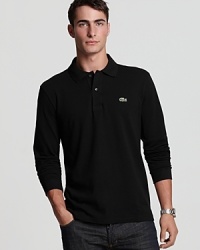 Lacoste's classic-fit polo with long sleeves, ribbed trim and embroidered logo at the left chest. Lacoste's classic-fit polo with long sleeves, ribbed trim and embroidered logo at the left chest.