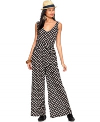 Perfect for a spring daytime ensemble, this dot-printed Bar III jumpsuit channels the stylish seventies for a look that's both relaxed and fashion-forward! Perfect for a spring daytime ensemble, this dot-printed Bar III jumpsuit channels the stylish seventies for a look that's both relaxed and fashion-forward!