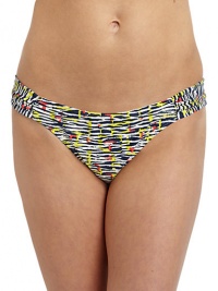 THE LOOKAbstract animal printSide ruched panelsLogo-embossed button at frontElastic waist and leg openingsTHE MATERIAL80% nylon/20% spandexFully linedCARE & ORIGINHand washImportedPlease note: Bikini top sold separately. 