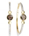 Stylish sophistication by Victoria Townsend. A traditional pair of hoop earrings gets played up by round-cut smokey topaz (2-5/8 ct. t.w.) and sparkling diamond accents. Set in 18k gold over sterling silver and sterling silver. Approximate diameter: 1-5/8 inches.