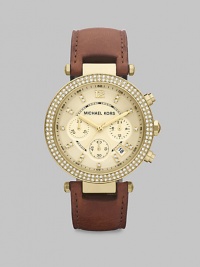 Supple leather and dazzling Swarvoski crystals add interest to this goldtone technical timepiece. Quartz movementWater resistant to 10 ATMRound goldtone stainless steel case, 39mm (1.5) Swarvoski crystal accented bezelChampagne chronograph dialSwarvoski crystal hour markersDate display between 4 and 5 o'clockSecond hand Chocolate leather bandImported Supple leather and dazzling Swarvoski crystals add interest to this goldtone technical timepiece. Quartz movementWater resistant to 10 ATMRound goldtone stainless steel case, 39mm (1.5) Swarvoski crystal accented bezelChampagne chronograph dialSwarvoski crystal hour markersDate display between 4 and 5 o'clockSecond hand Chocolate leather bandImported