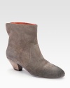 A western-inspired casual favorite, impeccably crafted of rich suede with a stacked heel. Stacked heel, 2¼ (60mm)Suede upperPull-on styleLeather lining and solePadded insoleImported