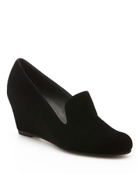 Smoking loafer looks on a sleek wedge heel define this Stuart Weitzman style. Smoking loafer looks on a sleek wedge heel define this Stuart Weitzman style.