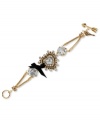 A little heart goes a long way. This darling toggle bracelet from Betsey Johnson boasts a heart charm with crystal accents and large crystal stones with a black grosgrain ribbon bow. Crafted in antiqued gold tone mixed metal. Approximate length: 7-1/2 inches long. Approximate width: 1-1/2 inches.