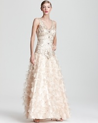 From the opulently beaded bodice to the full skirt of airy petals, this gala-ready Sue Wong gown makes a showstopping statement at every twirl. From the opulently beaded bodice to the full skirt of airy petals, this gala-ready Sue Wong gown makes a showstopping statement at every twirl.