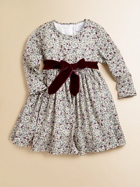 Blooming with a vivid floral print and a velvet tie, this delightful cotton frock will make your little one feel like a flower girl.Ruffled round necklineLong sleevesBack buttonsWaistband with velvet ribbon tieFull skirtFully linedCottonMachine washImported Please note: Number of buttons may vary depending on size ordered. Blooming with a vivid floral print and a velvet tie, this delightful cotton frock will make your little one feel like a flower girl.Ruffled round necklineLong sleevesBack buttonsWaistband with velvet ribbon tieFull skirtFully linedCottonMachine washImported Please note: Number of buttons may vary depending on size ordered.