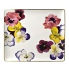 Pensees tray by Bernardaud. This lively, luxurious collection is sure to transform your table into a celebration of spring. The floral watercolor pattern features delicate, multicolored pansies that appear to be strewn across the surface of each piece.