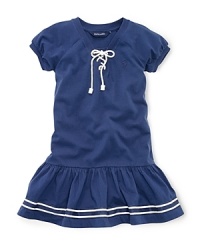 A drop-waist cotton jersey dress with nautical-inspired details is the perfect mix of sportswear and girlie style. A drop-waist cotton jersey dress with nautical-inspired details is the perfect mix of sportswear and girlie style.