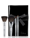 This deluxe travel brush set includes deluxe sizes of Dior's Backstage Powder, Cheek, Eyeshadow and Lip brushes in a foldable patent brush roll. 