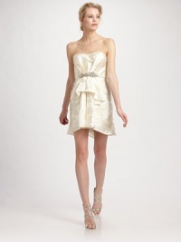 A bejeweled appliqué at the waist and charming ruffle front make a striking evening number.Strapless neckline Boned bodice Beaded and sequined appliqué at waist Ruffle front Back zipper Fully lined About 33 from shoulder to hem Polyester Dry clean Made in USA of imported fabric A bejeweled appliqué at the waist and charming ruffle front make a striking evening number.Strapless neckline Boned bodice Beaded and sequined appliqué at waist Ruffle front Back zipper Fully lined About 33 from shoulder to hem Polyester Dry clean Made in USA of imported fabric