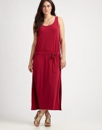 Utterly flattering, this sleeveless dress features a feminine neckline, an elasticized waist and a self-tie belt that will define your shape.U-neckSleevelessDropped waistSelf-tie beltSide slitsAbout 38 from natural waist94% polyester/6% spandexMachine washImported