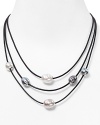 Softly glowing manmade pearls stylishly punctuate this triple-strand leather necklace from Majorica.
