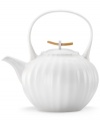 Look and feel. The purity of white china and natural texture beloved by Donna Karan make the Porcelain Touch teapot a brilliant addition to modern tables. With wooden detail in lid.