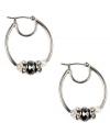 Sophisticated in silver. Nine West's darling hoop style showcases tonal plastic beads and rondelles embellished with crystal stones. Crafted in imitation rhodium-plated mixed metal. Approximate drop: 1-1/4 inches. Approximate diameter: 1 inch.