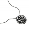 Love can be a complicated affair. Fossil embraces both sides of romance with this dark hematite-plated mixed metal rose pendant accented with sparkling crystals. Approximate length: 18 inches. Approximate drop: 1/2 inch.