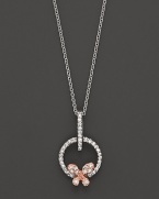 A dainty diamond butterfly pendant set in 14K. rose and white gold.