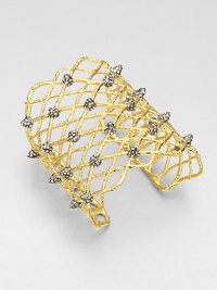 From the Elements Siyabona Collection. A wonderfully wide woven net pattern of textured goldtone, dotted with spikey clusters of dazzling Swarovski crystals.CrystalGoldtone and ruthenium platingDiameter, about 2.25 (adjustable)Width, about 3Imported From the Elements Siyabona Collection. A wonderfully wide woven net pattern of textured goldtone, dotted with spikey clusters of dazzling Swarovski crystals.CrystalGoldtone and ruthenium platingDiameter, about 2.25 (adjustable)Width, about 3Imported