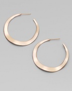 Simple, subtle wavy hoops, in sterling silver and 18k gold, glow with the warm finish of 18k rose goldplating.18k gold and sterling silver with 18k rose goldplatingDrop, about 1½PiercedImported