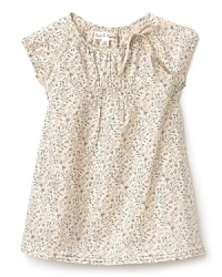 Cap sleeve dress with a vintage appeal, rendered in a soft beige base with muted floral prints. The crewneck and sleeves are gathered, while the hem is pleated and flowing. Cap sleeve dress with a vintage appeal, rendered in a soft beige base with muted floral prints. The crewneck and sleeves are gathered, while the hem is pleated and flowing.