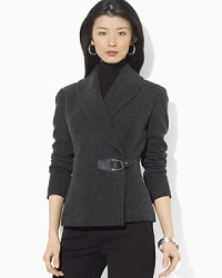 In heritage inspiration, a wool tweed jacket is crafted with a shawl collar and finished with luxe leather accents. In heritage inspiration, a wool tweed jacket is crafted with a shawl collar and finished with luxe leather accents.