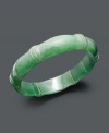 Slip serene style over your wrist. This classically cool bangle features a smooth jade setting (16 mm) with 14k gold accents. Approximate diameter: 3 inches.