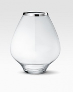 A masterful balance between strength and poetry, handcrafted in glass with a bulb-like shape that does justice to your most artful flower arrangements. From the Grace CollectionGlass with stainless steel rim8¼H X 7 diam.Hand washImported