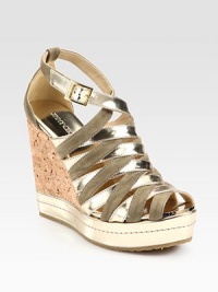 A beautifully crafted silhouette of metallic leather and suede, heightened by a powerful cork wedge. Cork wedge with metallic leather trim, 4¾ (120mm)Metallic leather platform, 1 (25mm)Compares to a 3¾ heel (95mm)Metallic leather and suede upperAdjustable ankle strapLeather liningRubber solePadded insoleMade in Spain A beautifully crafted silhouette of metallic leather and suede, heightened by a powerful cork wedge. Cork wedge with metallic leather trim, 4¾ (120mm)Metallic leather platform, 1 (25mm)Compares to a 3¾ heel (95mm)Metallic leather and suede upperAdjustable ankle strapLeather liningRubber solePadded insoleMade in Spain
