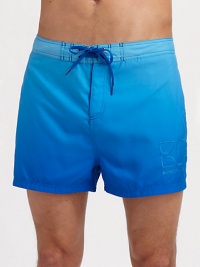 A shorter, classic fit made for sunny beachside days with quick-dry comfort and gently fading color. Drawstring waist Embroidered logo detail Mesh lining Inseam, about 4 Polyester Machine wash Imported 