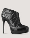 Bold leather booties are quilted and finished with a shiny dash of patent. By Burberry.