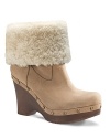 Boho meets moto in these UGG® Australia studded clog booties. Foldover sheepskin cuffs add versatility to the style.