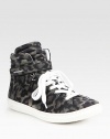 Sporty, suede high top sneaker updated by a leopard print, Velcro® strap and lace-up front. Rubber platform, 1 (25mm)Leopard-print suede upperLeather liningRubber solePadded insoleMade in PortugalOUR FIT MODEL RECOMMENDS ordering true whole size; ½ sizes should order the next whole size down. 