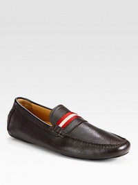 Traditional driver style exquisitely crafted in pebbled leather with signature trainspotting detail.Leather upperLeather liningPadded insoleRubber soleMade in Switzerland Traditional driver style exquisitely crafted in pebbled leather with signature trainspotting detail.Leather upperLeather liningPadded insoleRubber soleMade in Switzerland