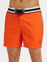 A quick-dry look with brilliant color revives a classic beach style. Drawstring waistBack flap pocketsMesh liningInseam, about 6PolyesterMachine washImported A quick-dry look with brilliant color revives a classic beach style. Drawstring waistBack flap pocketsMesh liningInseam, about 6PolyesterMachine washImported