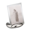 Accommodating either a vertical or horizontal photo, this rectangular photo frame consists of an oval base made of Nambé alloy and two sheets of glass to enclose a photo. The Nambé alloy base is solid and stable. Designed by Neil Cohen.
