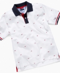 An allover flag print on this Franklin polo shirt from Tommy Hilfiger makes this look perfect for his summer style. An allover flag print on this Franklin polo shirt from Tommy Hilfiger makes this look perfect for his summer style.