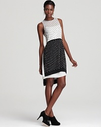 Black and white, sheer and rhinestones, short and long - this playfully chic dress embodies the creative yin and yang of DIANE von FURSTENBERG's style. Black and white, sheer and rhinestones, short and long - this playfully chic dress embodies the creative yin and yang of DIANE von FURSTENBERG's style.
