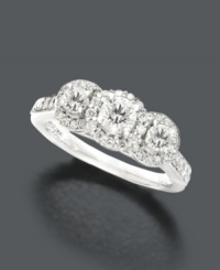 A full carat of sparkling diamond will take her breath away. Set in 14k white gold, this sparkling three stone ring features three predominate round-cut diamonds (1 ct. t.w.) surrounded by round-cut diamond edges and channel-set diamonds along the shank. A full carat of sparkling diamond will take her breath away. Set in 14k white gold, this sparkling three stone ring features three predominate round-cut diamonds (1 ct. t.w.) surrounded by round-cut diamond edges and channel-set diamonds along the shank.