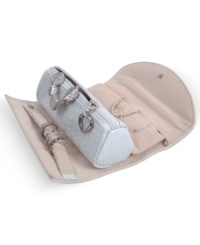The ultimate travel accessory, the Jenna jewelry roll keeps your favorite pieces within reach when you're on the road. Featuring a faux leather exterior, crocodile feel and silvertone metal heart pull for glamor on the go. The ultimate travel accessory, the Jenna jewelry roll keeps your favorite pieces within reach when you're on the road. Featuring a faux leather exterior, crocodile feel and silvertone metal heart pull for glamor on the go.