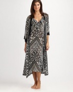 EXCLUSIVELY AT SAKS. Opposites attract in this flowy design featuring a striking tribal-inspired print. V-neckThree-quarter length sleevesSolid trim at the neckline and cuffsSelf-tie waistAbout 53 from shoulder to hemPolyesterMachine washImported