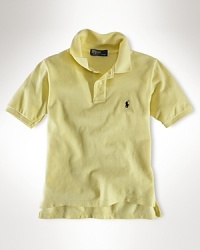 Essential short-sleeved polo shirt in breathable cotton mesh. Ribbed polo collar and armbands. Uneven vented hem. Signature embroidered pony accents the chest. Essential short-sleeved polo shirt in breathable cotton mesh. Ribbed polo collar and armbands. Uneven vented hem. Signature embroidered pony accents the chest.