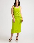 If you are looking for a design that represents comfort and style, you have found it. Made from a soft fabrication and featuring a self-tie detail at its elasticized waist, this dress is a must.ScoopneckSleevelessSelf-tie belt at elasticized waistSide slitsAbout 38 from natural waist94% polyester/6% spandexMachine washImported