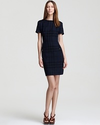 An oversized check print glorifies a classic Burberry Brit sheath dress, while a black and blue palette lends contemporary appeal. Roughen up the sleek silhouette with an edgy leather jacket for urban polish. An oversized check print glorifies a classic Burberry Brit sheath dress, while a black and blue palette lends contemporary appeal. Roughen up the sleek silhouette with an edgy leather jacket for urban polish.