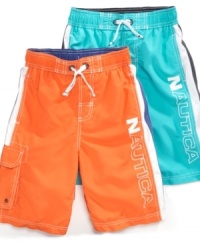 Color splash. With one of these bright, bold swimsuits from Nautica he'll stand out in the surf this summer. Color splash. With one of these bright, bold swimsuits from Nautica he'll stand out in the surf this summer.