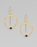 From the Clover Collection. A simple, delicate hoop of 24K gold with a single black diamond accent.Black diamond, 0.24 tcw 24K yellow gold Width, about ¾ Length, about 1 Ear hooks Imported 