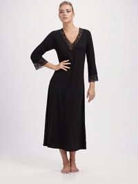 Sophisticated, silky and trimmed with lace at the v-neckline.Three-quarter sleeves About 50 from shoulder to hem Polyester; machine wash Imported Sophisticated, silky and trimmed with lace at the v-neckline.Three-quarter sleeves About 50 from shoulder to hem Polyester; machine wash Imported