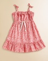 A pretty woven vine print with ruffles at the neck and hem is your little girl's ultimate warm-weather frock.Tie shoulder strapsElasticized neckline with double rufflesSlightly high, elasticized waist with tieFull skirt with wide ruffled hemPullover stylingCottonMachine washImported